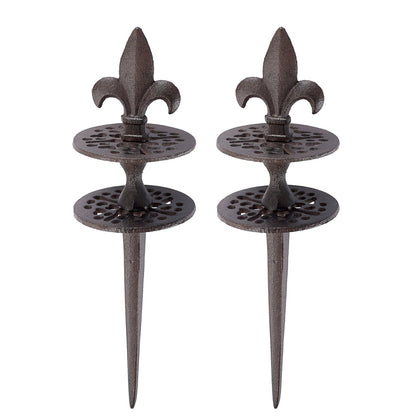 OwnMy cast iron hose guide stake with spear tip pattern protects flower beds during watering.