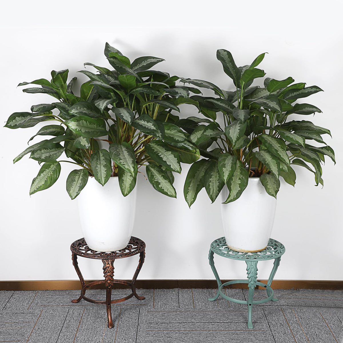 OwnMy outdoor indoor stand in garden setting with rust-resistant electroplated finish.