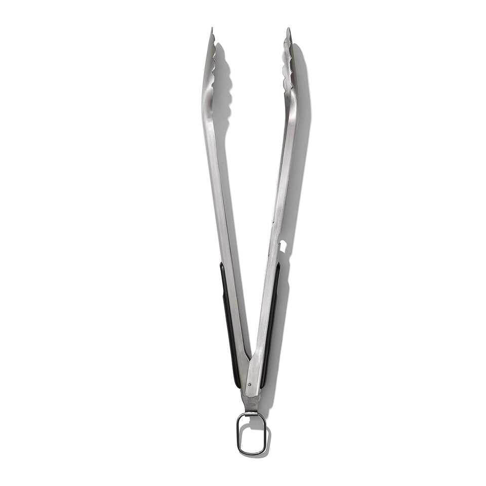 OXO Outdoor Grilling Tongs in rust-resistant steel ready for heavy-duty barbecues