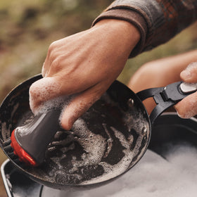 OXO Outdoor Heavy Duty Brush with Cover cover doubles as a scoop for camping