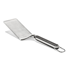 OXO Outdoor Large Griddle Turner in action flipping pancakes on a hot griddle