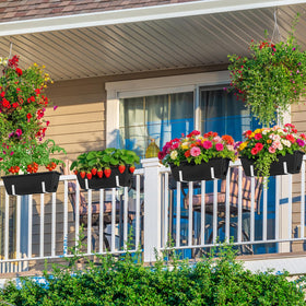 OYEAL planters placed on a windowsill and on a deck for versatile use.