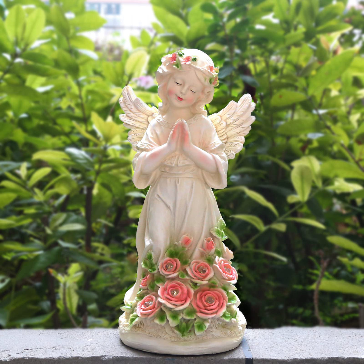 Panven solar angel garden light glows at dusk, creating a warm outdoor ambiance.