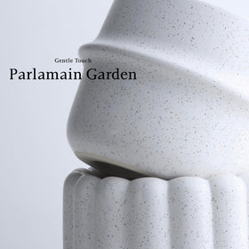 Parlamain terrazzo-style pots bring modern texture to living room shelves