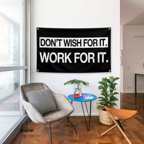 parrekek Grind Hustle Flag hanging in a bedroom for daily motivation