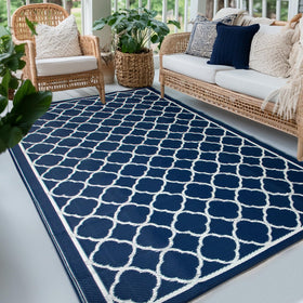PASAMIC waterproof outdoor rug 8x10 ft spread on patio showing quick-dry performance