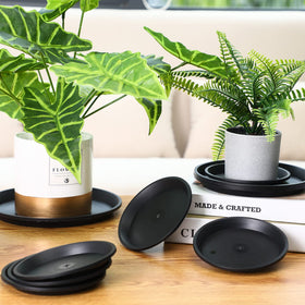 Patelai 8-inch black plant saucer fits larger pots and keeps floors dry.