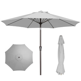PatioKingdom 9ft umbrella open over a dining setup, providing comfortable shade.