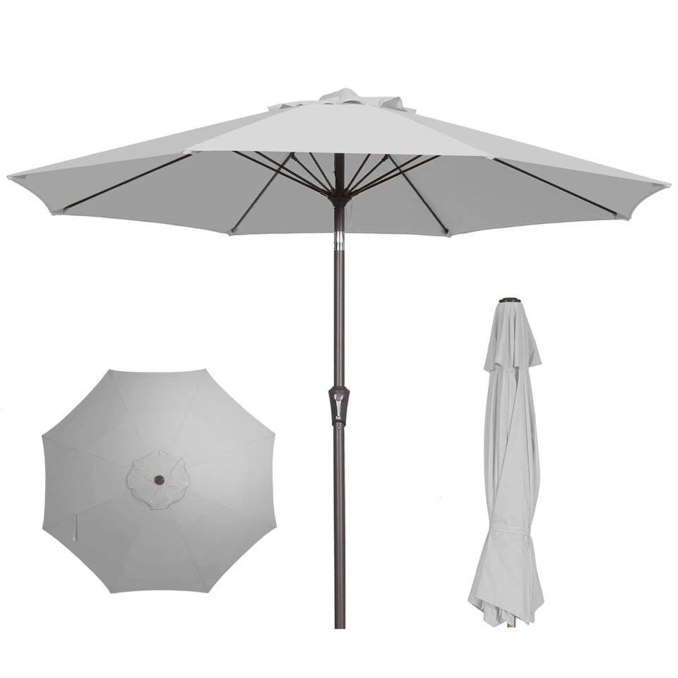 PatioKingdom 9ft umbrella open over a dining setup, providing comfortable shade.