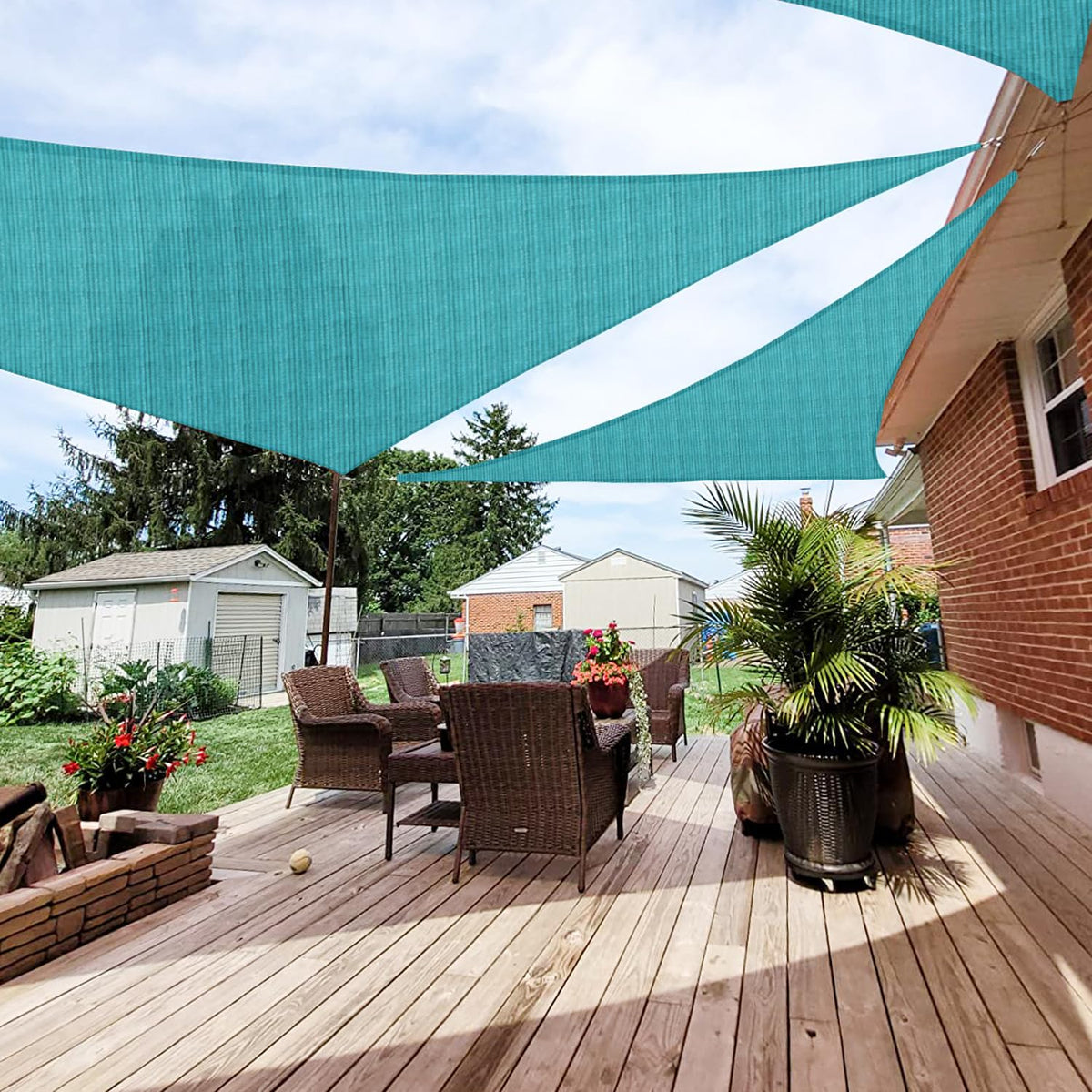Patio Paradise triangle sun shade sail blocks sunlight while keeping outdoor spaces cooler.