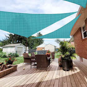 Patio Paradise triangle sun shade sail blocks sunlight while keeping outdoor spaces cooler.