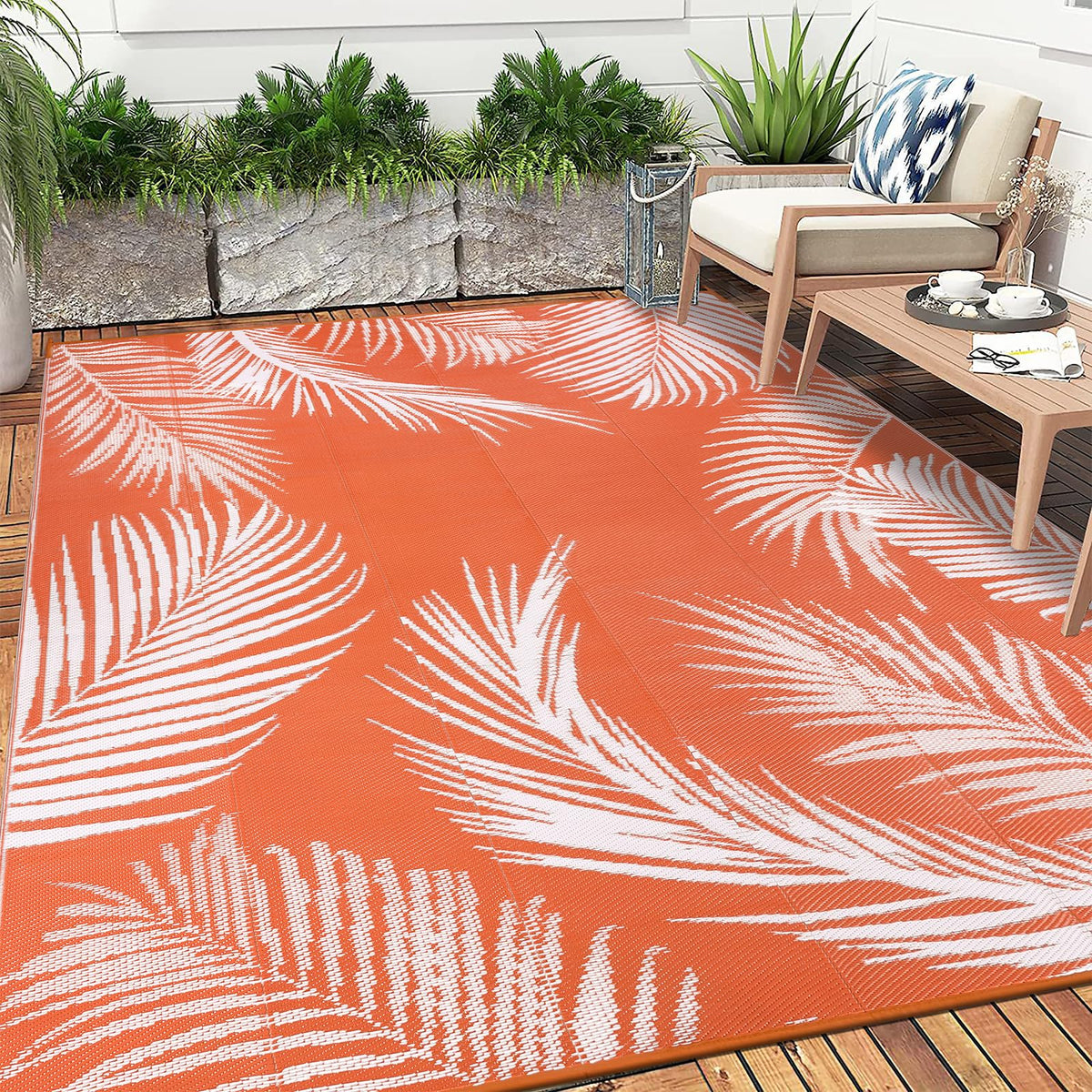 Pauwer leaf-orange rug adds soft, cozy underfoot for outdoor spaces.