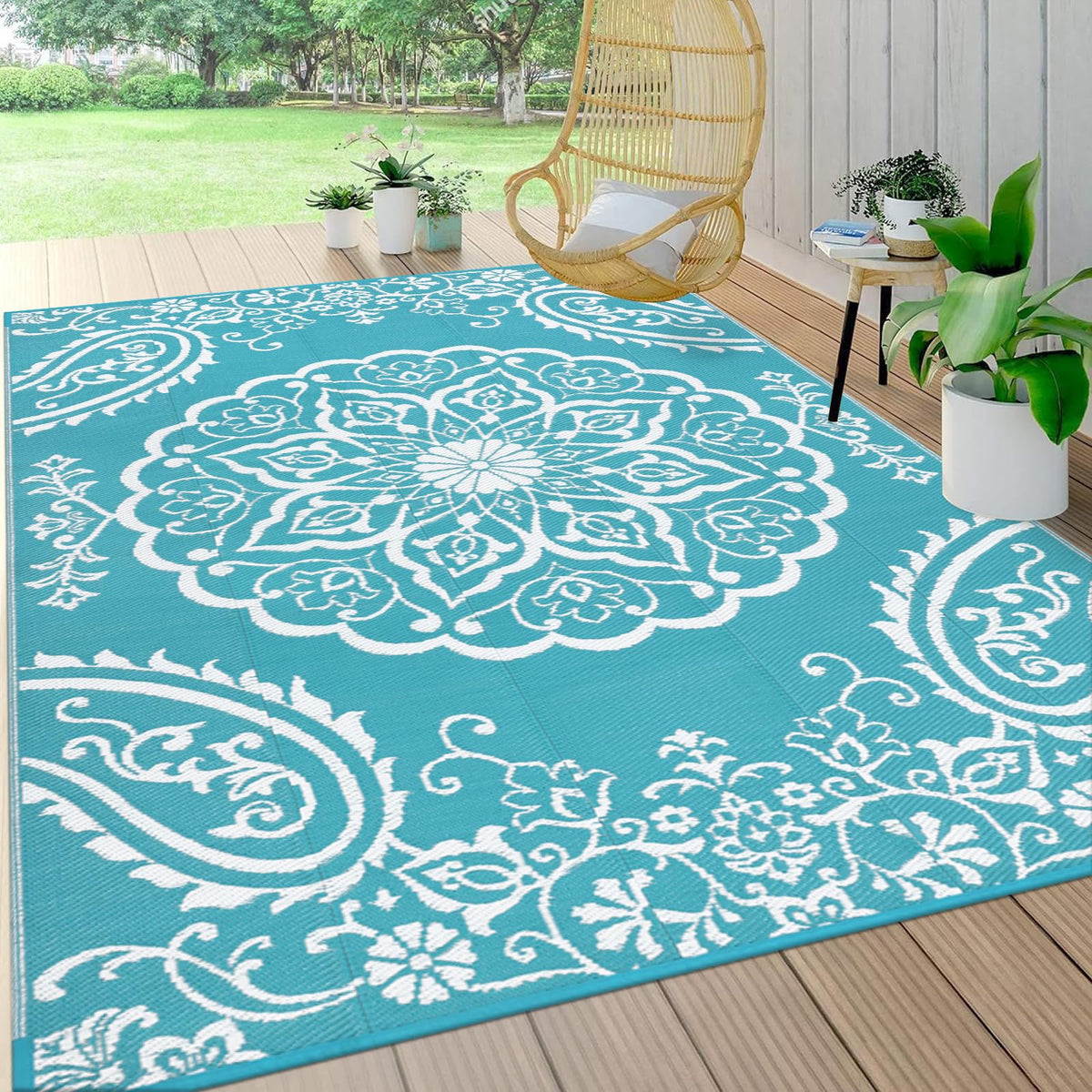 Pauwer reversible outdoor rug with floral pattern enhances patio decor.