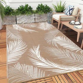 Pauwer RV camping scene with rug on ground for outdoor comfort.
