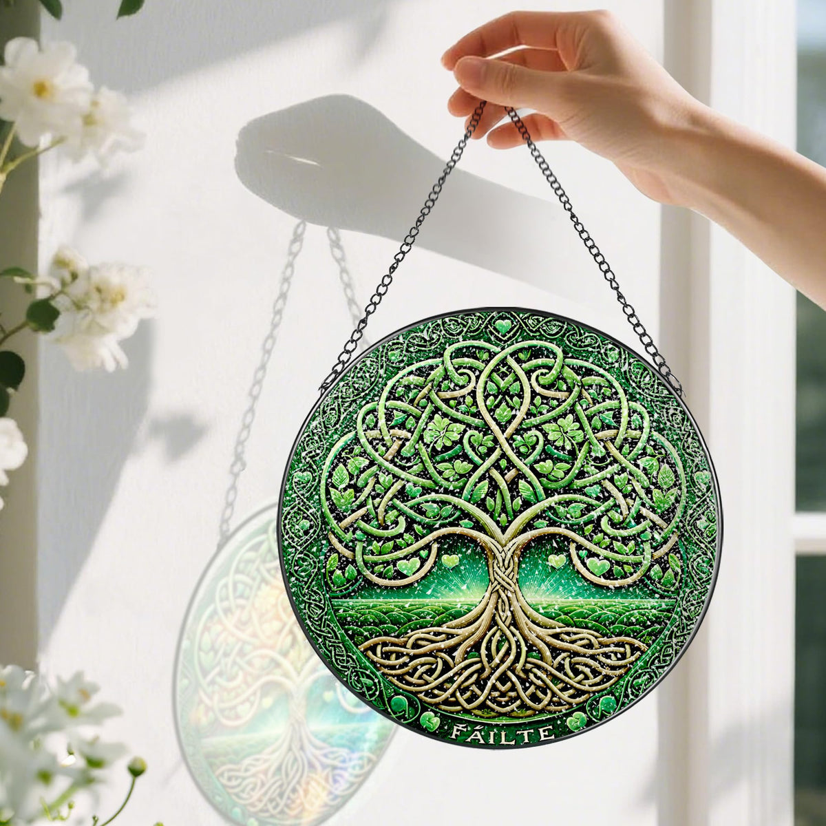 Pauyadu Tree of Life glass art ornament framed by sunlight