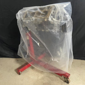 PeakRider clear engine bag cover shown secured with a rubber band