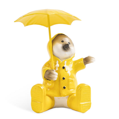 pechpell yellow raincoat chick holding umbrella enhances garden decor with cheerful charm