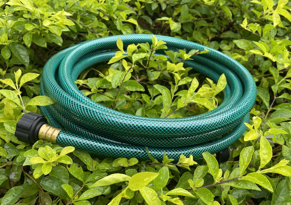 PEISONGFEI garden hose being used to water plants and wash a car.
