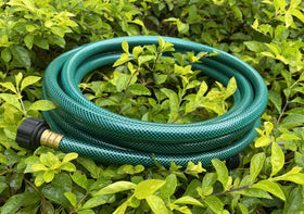 PEISONGFEI garden hose being used to water plants and wash a car.