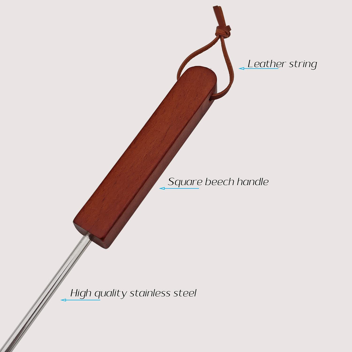 Wooden handle BBQ turner on grill close-up with grip