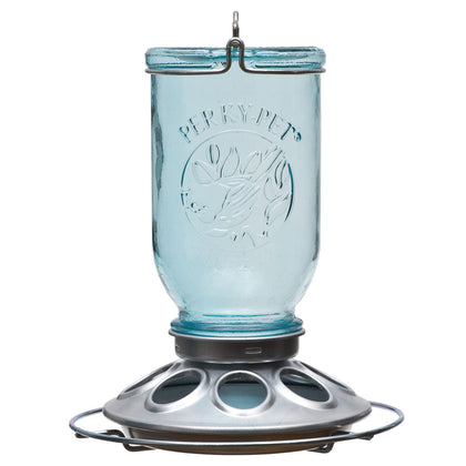 Perky-Pet Mason Jar Wild Bird Feeder with vintage blue bottle for backyard feeding.
