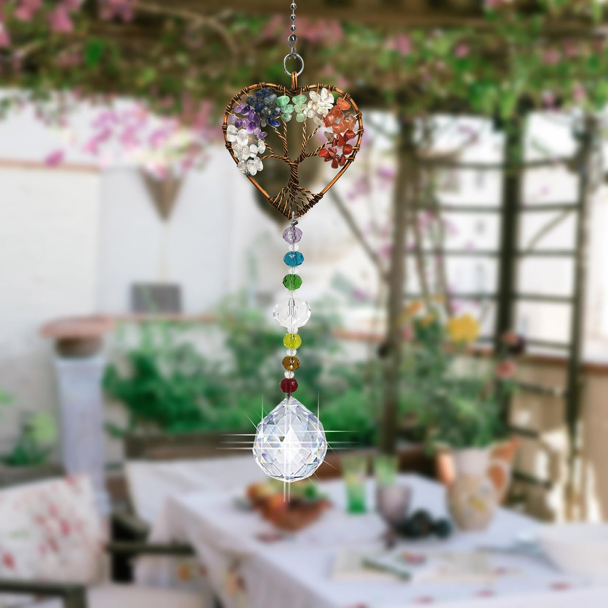 Persofine heart-shaped crystal suncatcher captures sunlight, creating colorful rainbows