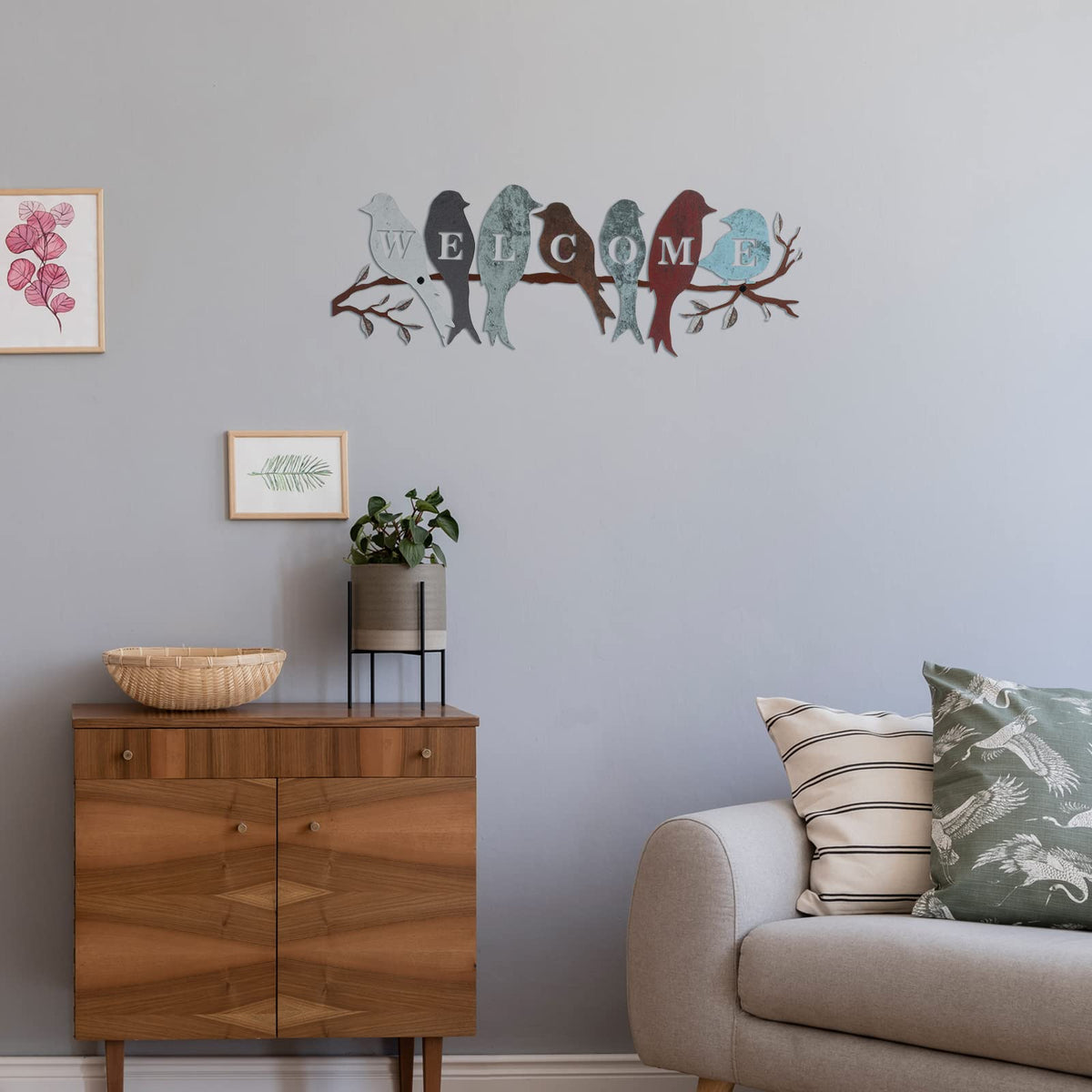 Bird artwork on branch adds vibrant color to entryways