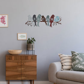 Bird artwork on branch adds vibrant color to entryways