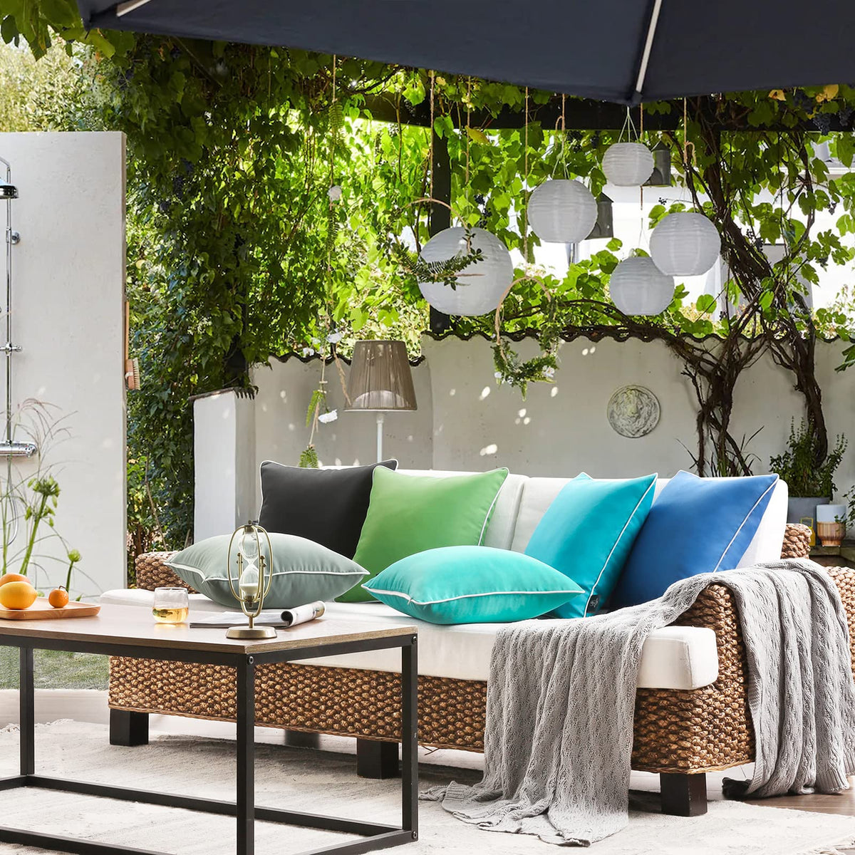 Indoor-outdoor versatility shown with Phantoscope forest green pillow cover.