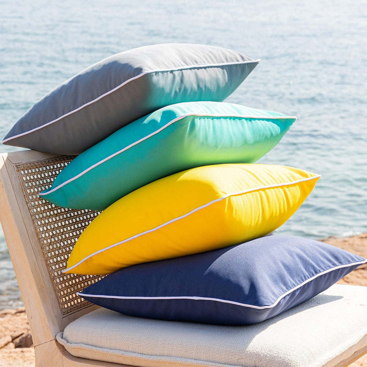Phantoscope indoor-outdoor yellow 18x18 pillow cover on seating area