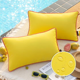 Phantoscope lemon-yellow outdoor pillow cover with contrast piping enhances patio decor.