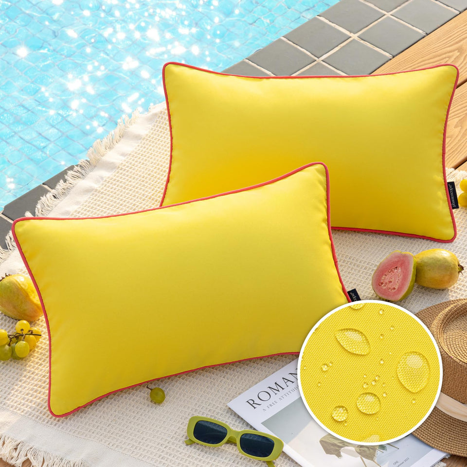 Phantoscope lemon-yellow outdoor pillow cover with contrast piping enhances patio decor.