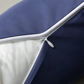 Phantoscope vibrant dark blue outdoor pillow cover shown in a garden setting.