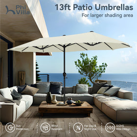 PHI VILLA umbrella protecting guests from sun at backyard lounge