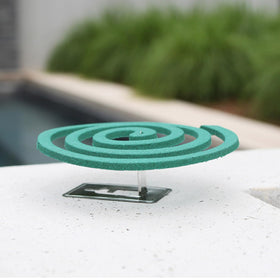 PIC Mosquito Coils on patio stand providing portable outdoor protection.