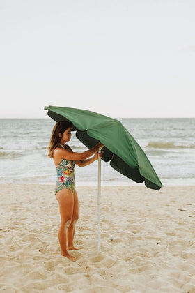 PICNIC TIME umbrella pairs with chairs and tables having built-in slots.