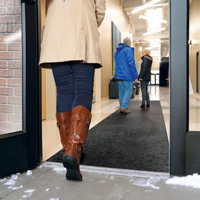 PIG Grippy Floor Mat 3' x 100' runner installed in a high-traffic doorway