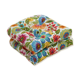 Pillow Perfect bright floral wicker cushion set enhances patio decor with blue-purple tones
