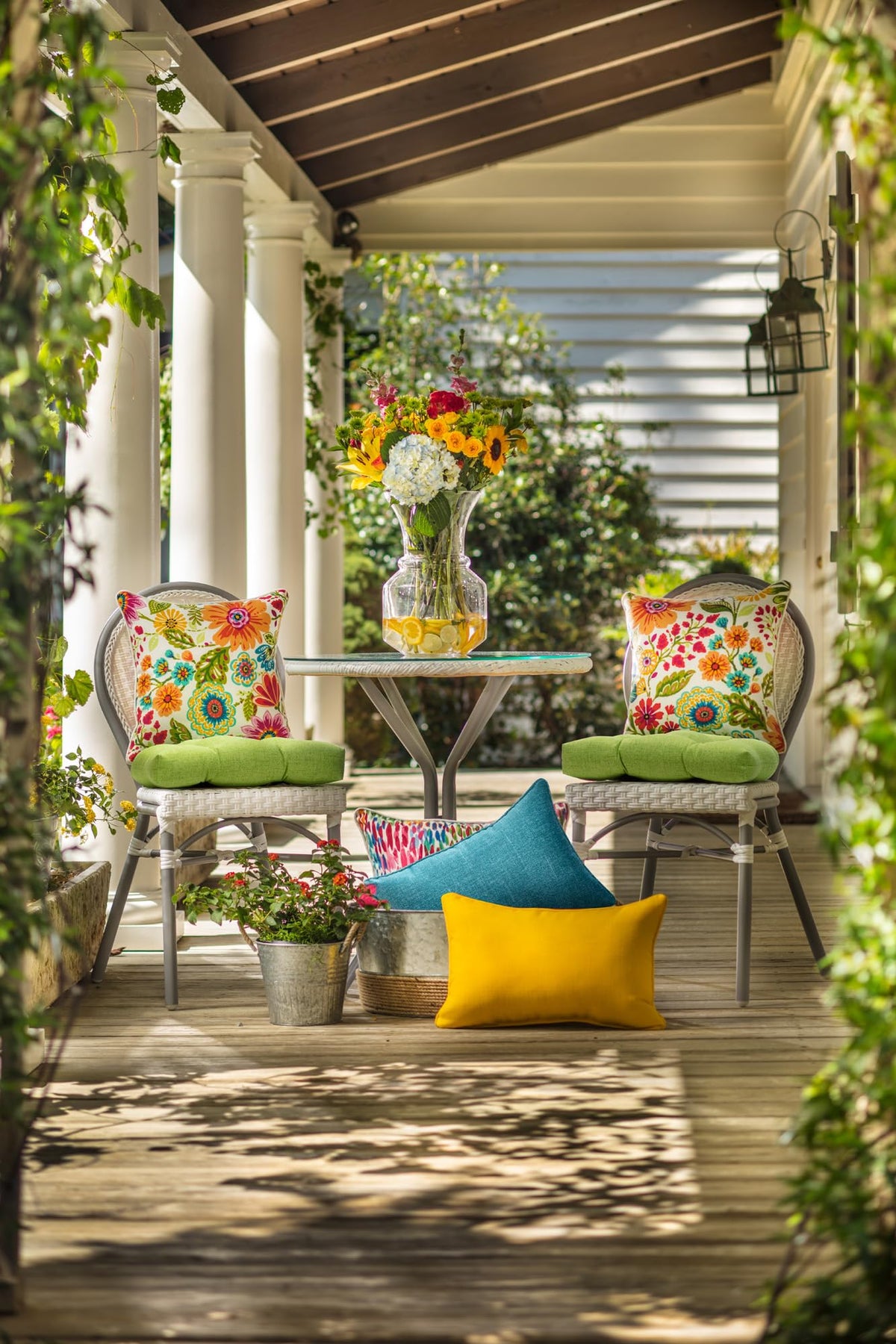 Pillow Perfect reversible tufted cushion adds indoor or outdoor seating versatility