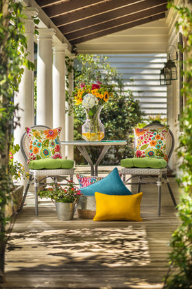 Pillow Perfect reversible tufted cushion adds indoor or outdoor seating versatility
