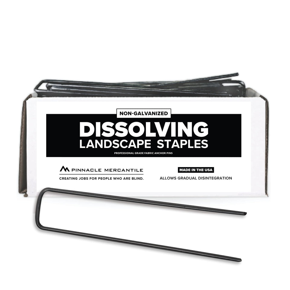 Pinnacle Mercantile USA-made dissolving staples securing landscape fabric in garden beds.
