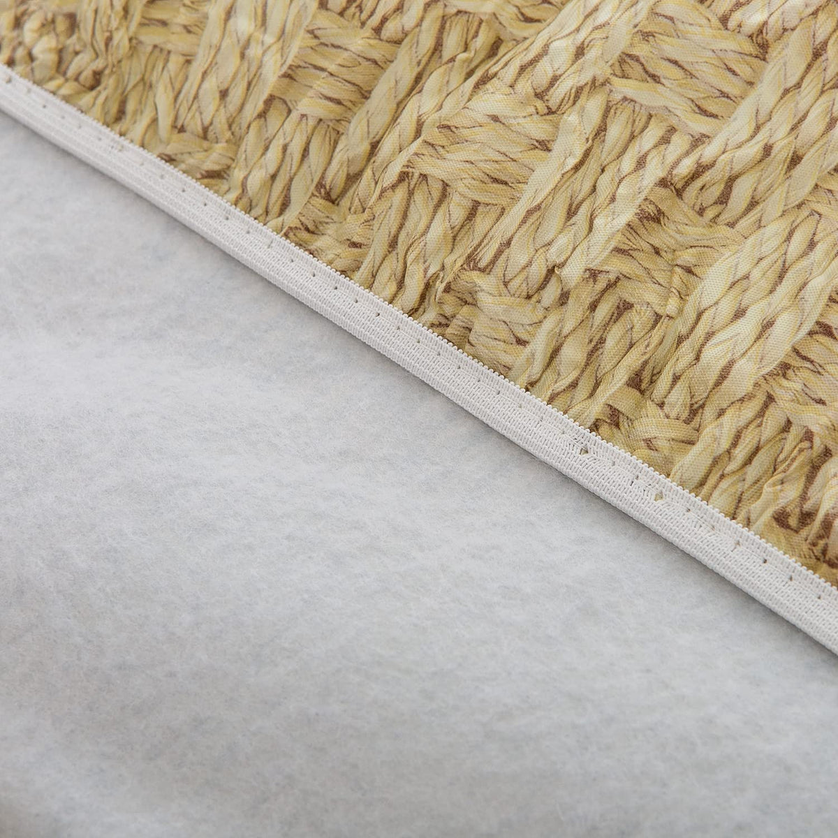 Easy clean Pioggia tablecloth visible being wiped with a damp cloth.