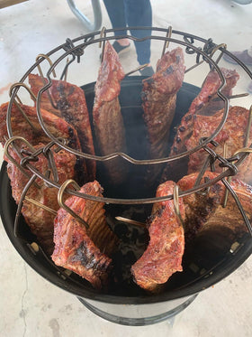 Pit Barrel hook remover helps you handle meat safely.