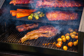 Cherry pellets on grill create fruity smoke for poultry and seafood