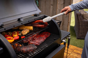 Pit Boss Navigator 850 side view showing fold-out prep shelves