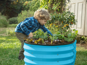 Plant & Plot teal assembly process of raised bed shown.