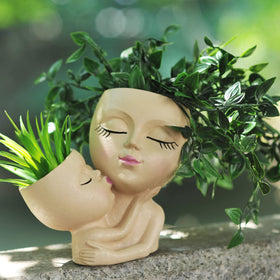 PlotX head planter side view highlights hug motif for cozy decor
