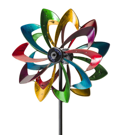 Plow & Hearth solar panel-centered flower spinner lights at night.