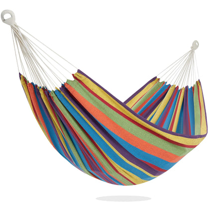 PNAEUT double hammock outdoors on a tree for tropical relaxation.