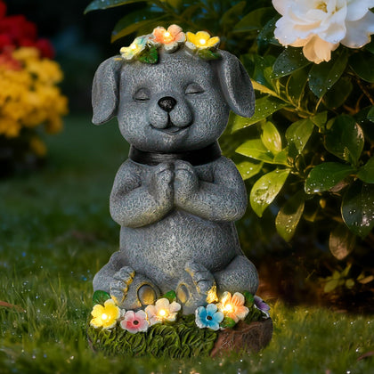 Pohabery meditating dog garden statue glowing softly in twilight for tranquil outdoor ambiance